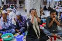 Bangladeshi Muslim devotees pray before breaking their day-long fast at a shrine during the holy month of Ramadan in Dhaka, Bangladesh. (AP/ A.M. Ahad).