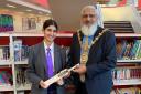 Mayor Suleman Khonat giving Momena Ahmed the signed cricket bat