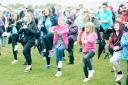 FITNESS: Isabella Taylor, of Bacup, and Brooke Wilcock, of Waterfoot, at the front of the warm-up.
