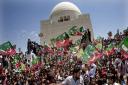 Supporters of Pakistan Tehreek-e-Insaf headed by Pakistan's cricket star-turned-politician Imran Khan, rally at the mausoleum of Mohammad Ali Jinnah, founder of Pakistan in Karachi, Pakistan, Tuesday, May 7, 2013
