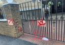 Aftermath: gates at the mosque are daubed in red after the latest incident