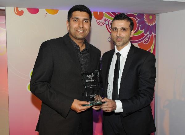 Senior Policy Officer Equalities and Cohesion at Lancashire County Council Saeed Sidat presents the Public Service Award to Wajid Khan who was representing Dr Alethea Melling on the night.