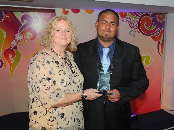 Glenda Brindle, Head of School of Creative and Performing Arts and Director of the International Fashion Institute UCLan presents the Education Achievement award to Idanan Zaffar.