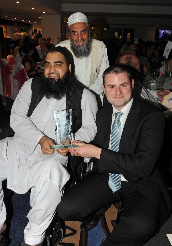 Andrew Stephenson new Conservative MP for Pendle presents the Man of the Year award to Kamran Ahmed.