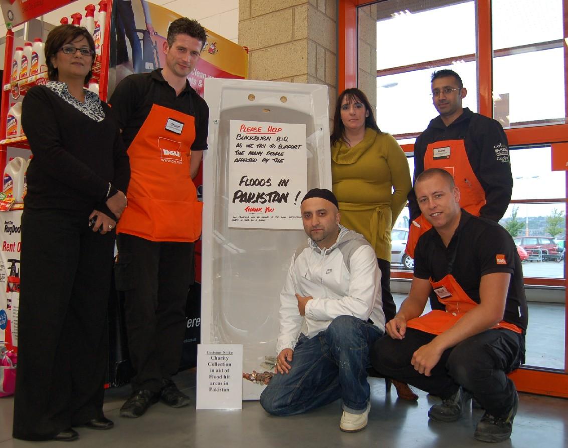 The B&Q store in Blackburn and Womans Voice are raising  money for the flood effort.  Pictured above are:  Wendyanne  Smith  [Project  Manager] and Riff Haworth (Events  coordinator], Rapper Nas-T and members of the B&Q staff.