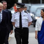 Prime Minister Boris Johnson and Home Secretary Priti Patel meet with Chief Constable of West Midlands Police Dave Thompson as they arrive at West Midlands Police Learning and Development Centre, Birmingham. (Toby Melville/PA)