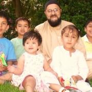 Ghulam Rasul Choudhry is pictured with his grandchildren