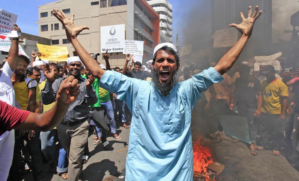 Sri Lankan Muslims shout slogans as they burn an effigy of U.S. President Barack Obama during a protest after Friday prayers near the U.S. embassy in Colombo, Sri Lanka, Friday, Sept. 21