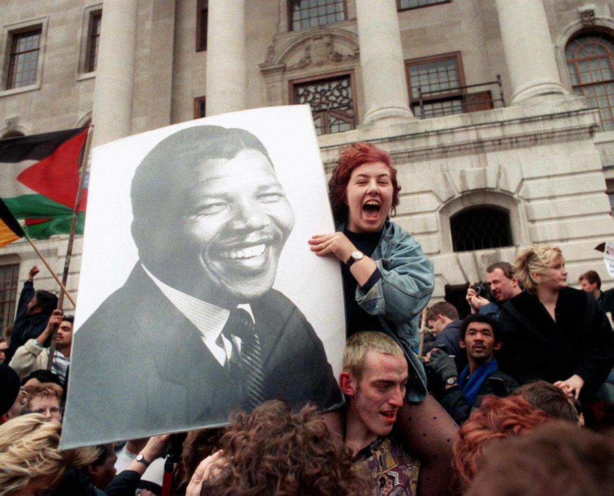 1990 of celebrations near the South African Embassy in Trafalgar Square on the announcement of the release of Nelson Mandela from a South African prison. 