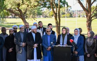 Ramia Abdo Sultan, lawyer and communications relations advisor of the Australian National Imams Council with Imams speaks during a press conference in Sydney (Dean Lewins/AP)