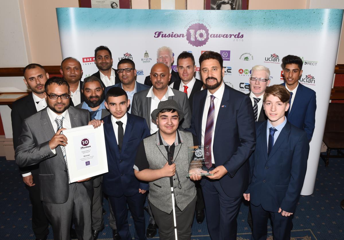 The Lancashire Lions Visually Impaired Cricket team are presented with the Human Appeal Achievement in Sport Award by Afzal Khan MEP