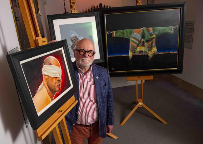Artist Robert McNeil MBE has unveiled three of his paintings, recently acquired by Glasgow Museums, at St Mungo Museum of Religious Life and Art. (Bill Murray/PA)
