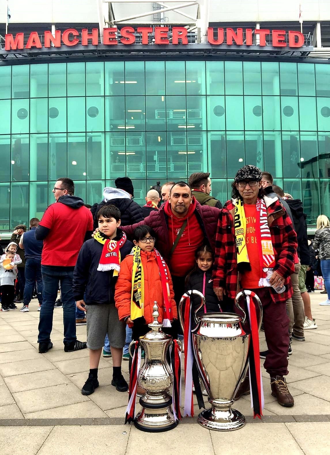 Mohammed Akhtar pictured with members of his family outside Manchester Uniteds ground