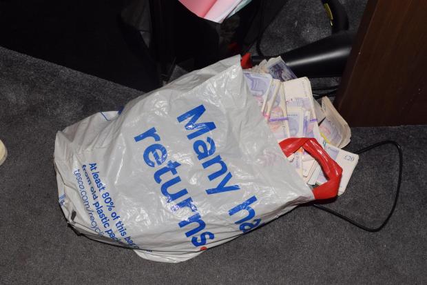 Asian Image: Vast amounts of cash were seized in evidence during the investigation [ERSOU]