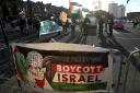 A banner stating Free Palestine Boycott Israel bought by protesters outside the ground before the UEFA Nations League Group F match at Hampden Park, Glasgow 4 September.  (Andrew Milligan/PA)