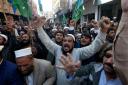 Supporters of Jamaat-e-Islami chant slogans during a protest in Peshawar, Pakistan, against the burning of the Koran, a Muslim holy book, by a Danish anti-islam activist