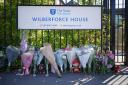 Flowers and toys placed outside the Study Preparatory School (Yui Mok/PA)