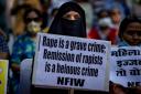 A woman protests against remission of sentence by the government to convicts of a gang rape of a Muslim woman in communal violence in 2002 in western Gujarat state, during a protest in New Delhi (AP)