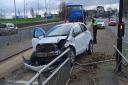 Car collides with railings on major Bradford road