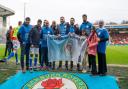 Group ambassadors Tez and Dilan Markanday with members of the South Asian Supporters (SAS) at Ewood Park