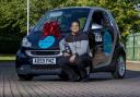 University of Bradford final year law student Shaikhul Amin with new smart car, which he won after taking part in a mock trial competition- Picture- University of Bradford