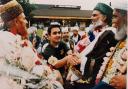 12 July 1996: In this wonderful moment a young man greets religious leaders near the Rightway Cash and Carry on Audley Range.