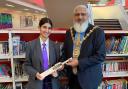 Mayor Suleman Khonat giving Momena Ahmed the signed cricket bat