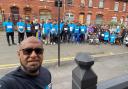 Afruz Miah with walkers who raised £20,000 for a family affected by a house fire in Oldham