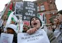 Protestors demonstrate outside the Israeli Embassy in Kensington, London. (PA)