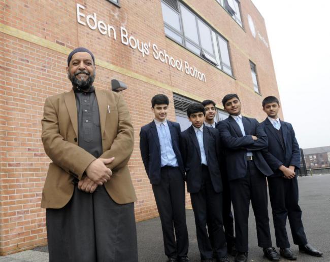 Principal Shabir Fazal with pupils at Eden Boys School.
