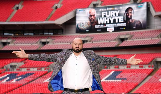Asian Image: Tyson Fury poses on the pitch after the press conference at Wembley Stadium, London (PA)