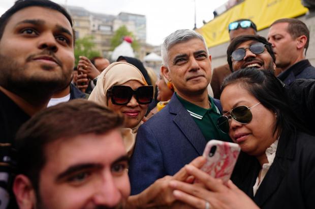 Mayor of London Sadiq Khan with visitors during the Eid in the Square festival in Trafalgar Square, London.