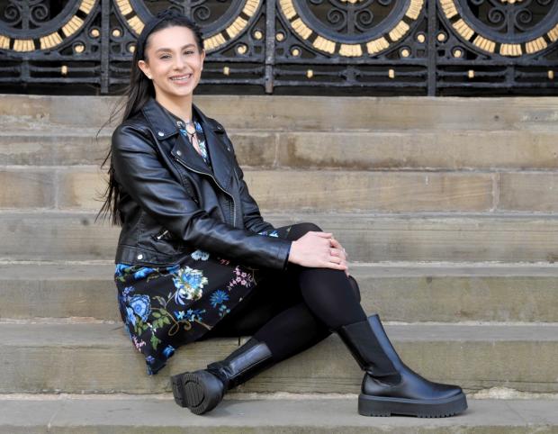 Asian Image: Bradford Masterchef contestant Radha Kaushal-Bolland sits on the steps of City Hall. 