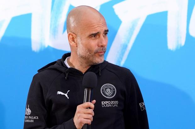 Manchester City manager Pep Guardiola on stage