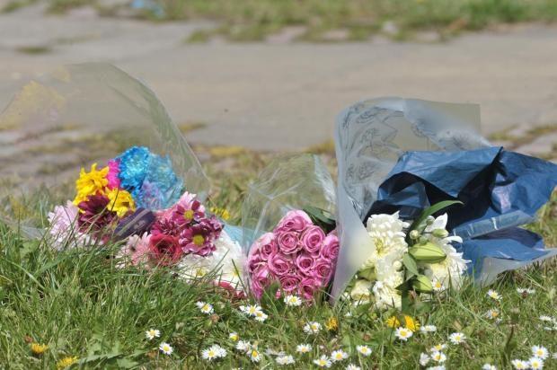 Asian Image: Floral tributes left at the scene in the aftermath of Mrs Shahzadi's death