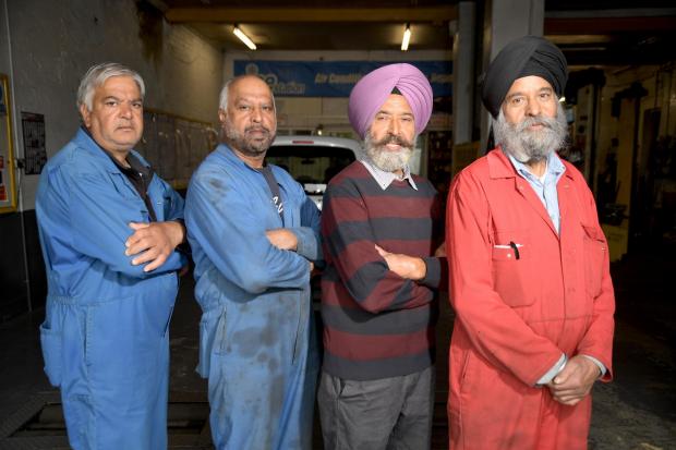 Asian Image: From left, Satpal Singh Sagu, Teja, Lehmber and Mangal at the Sagu Motors site in Bradford 