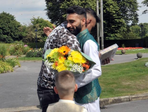 Asian Image: Shahid Parvez embrace Murtaza Ulhassan, whose life was saved at Blackpool