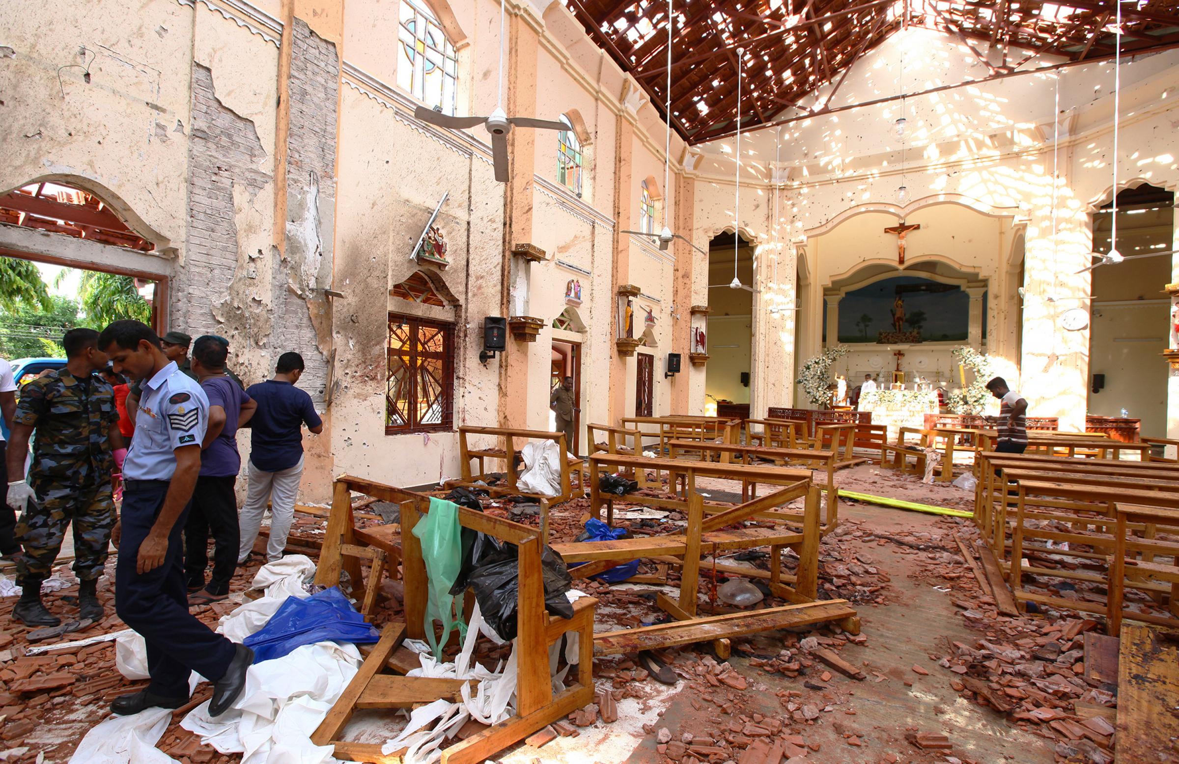 Sri Lankan officials inspect St. Sebastians Church in Negombo, north of Colombo, after multiple explosions targeting churches and hotels across Sri Lanka on April 21, 2019, in Negombo, Sri Lanka. At least 207 people have been killed and hundreds more