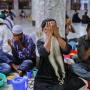 Bangladeshi Muslim devotees pray before breaking their day-long fast at a shrine during the holy month of Ramadan in Dhaka, Bangladesh. (AP/ A.M. Ahad).
