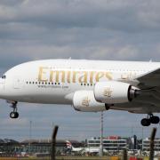 A Emirates Airbus A380 plane lands at Heathrow Airport