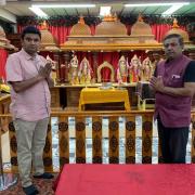 Sunny Patel and Pradeep Bhardwaj at the Swindon Hindu Temple altar. Some deities have been moved to a secret location for security reasons
