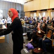 Aneelah Afzali, director of the American Muslim Empowerment Network, voices her opinion during a public hearing in the Seattle City Council chambers
