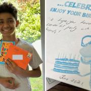 Muhammad who is a student at Queen Elizabeth’s Grammar School (QEGS) with the card which arrived two years late