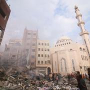 Israeli airstrikes destroyed buildings and civilians in Khan Younis in the Gaza Strip (Hatem Ali/AP)