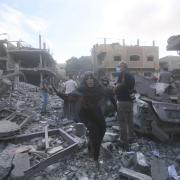 Palestinians flee Israeli bombardment of Rafah, southern Gaza Strip, Tuesday, Oct. 17, 2023.