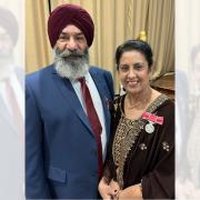 Kuldeep Dhillon and his wife Balbir Kaur, of Locking Stumps, after receiving their BEM honours