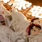 Dolls symbolising children that died during the conflict as healthcare workers and agencies in the