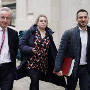 Minister for Levelling Up, Housing and Communities, Michael Gove (left), leaves the Millbank Studios in central London after taking part in the morning interview rounds.