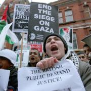 Protestors demonstrate outside the Israeli Embassy in Kensington, London. (PA)